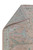 Folded corner revealing hand-knotted back, even weave and natural cotton fringe of Indian Oushak rug
