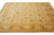 Beige and gold all-over floral rug viewed lengthwise showing its symmetrical vine layout