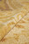 Rolled edge detail showing plush natural wool pile depth and soft golden sheen