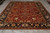 9x12 Oriental rug seen from the fringed end with deep black rosette main border
