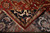 Folded corner revealing cotton foundation, even knotting and ivory fringe on this new rug