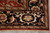 Corner view with triple border, tan guard stripe and hand-tied ivory fringe on tile