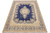 Navy blue 10x13 Oriental rug with ivory Kerman floral medallion shown flat on white