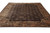 9' x 11'5" Tibetan wool rug photographed at an angle showing full border and field