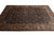Angled view of the brown transitional area rug with gold scrollwork border and soft pile