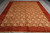 9x12 transitional Indian rug viewed from the end with gold rosettes and ivory fringe