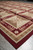Floor level angle of 9x12 Chinese needlepoint rug corner with layered border stripes