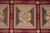 Single mosaic panel in detail with 8 petal rosette and red laurel leaf framing