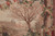 Bare winter tree, rose garland and distant palace in this hand-woven pictorial tapestry rug