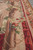 Side angle of the rose garland border, stone column and thin red guard stripes