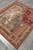 5'2" x 5'11" tapestry rug viewed lengthwise on grey floor, full scenic composition visible