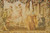 Close-up of the woven central scene showing figures on palace steps beside a small dog
