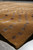 Close corner detail showing plush pile, selvage edge and silk highlighted dots on caramel brown ground