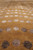 Ivory and silver silk dots catching light on a caramel ground, contemporary 8x10 rug detail