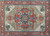 Full pattern view showing symmetrical Serapi medallion layout in red, ivory, sage and blue tones