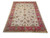 8'9 x 12'5 Indian wool rug angled to show all over floral field and border