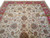 9x12 Oriental rug corner view with ivory field, red border and floral all over design