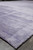 9'1" x 11'10" modern wool rug corner with finished side cord and lavender pile