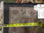 Back of the rug with tape measure and genuine hand woven Oriental rug identification tag