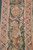 Vertical border panel detail with draped urn, garlands and teal bound edge on the wall hanging