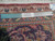 Ruler on reverse of semi-antique Kashan rug confirming authentic handmade knotting on cotton foundation