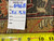Back of rug with inventory tag number 6468 and tape measure confirming hand-knotted construction