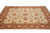 8x10 hand-knotted wool rug viewed from the front, ivory field framed by a rust red border