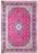 Magenta-toned studio photograph of Kashan rug showing ivory medallion, indigo borders and dense all-over floral field