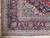 Corner detail showing indigo main border, light blue guard bands and ivory cotton fringe ends