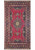 Overhead view of raspberry red Persian Tabriz rug with ivory star medallion and navy floral borders