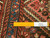 Ruler laid across the wool pile confirming authentic handmade knotting of this 13'2" Persian runner