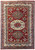 Overhead view of brick red Super Kazak rug with triple geometric medallions and ivory Greek key border
