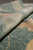 Rolled edge showing pile depth, hand finished selvage and hand-spun highland wool yarn texture