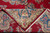 Folded corner revealing even hand-knotted weave, tight back and ivory selvage of this Persian rug