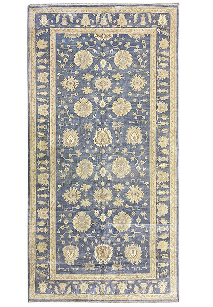 Full view of 10'2" x 20' Chobi Rug laid out with rich navy and gold colors