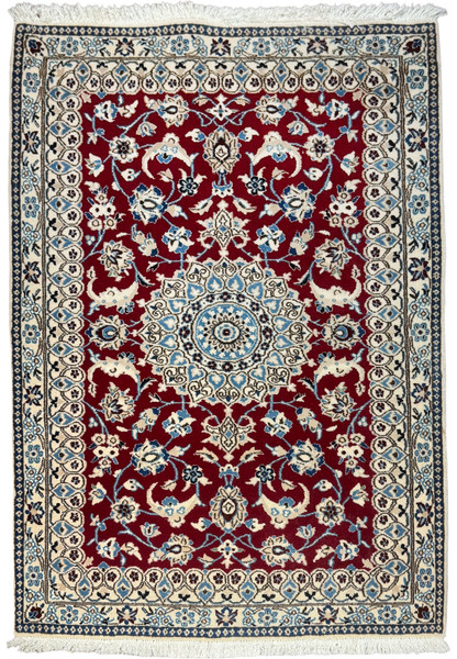 Full view of a 3x4'6 Persian Nain 9la rug with red field and ivory floral border