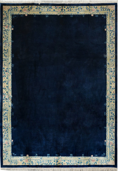 10x13’8 Beijing Art Deco rug with all-over navy blue field and pastel floral border.