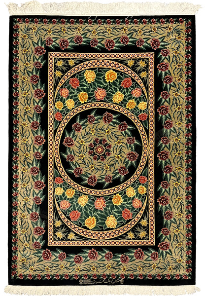 Full view of a 3'5 x 5'2 signed Persian Qum rug woven entirely in silk, featuring a black field, circular floral medallion, and richly detailed rose borders