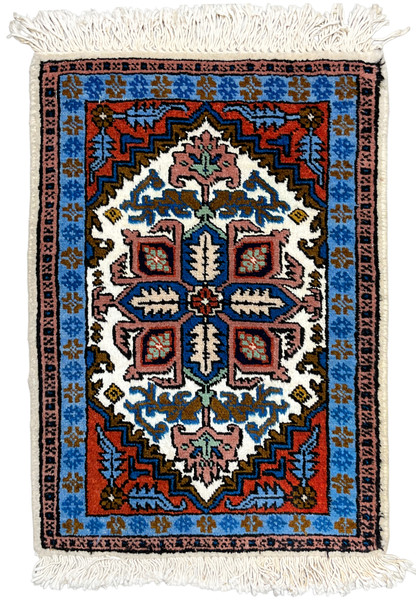 Full overhead view of 1'3 x 2 Persian Ardebil rug, stepped geometric medallion on ivory with rust and sky blue