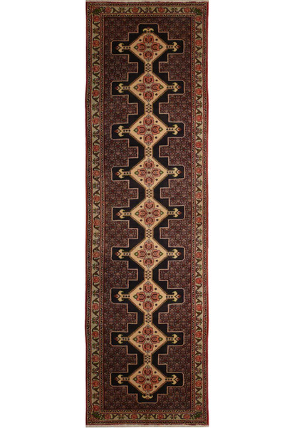 A close-up of a Persian Senneh runner featuring a geometric pattern in shades of blue, red, and ivory.