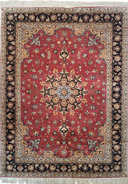 Elegant 5x7 Persian Tabriz Rug with Salmon and Navy Blue Hues on Display