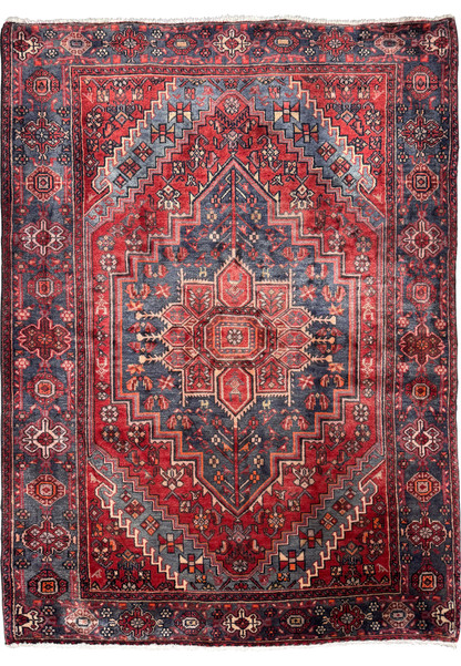 Full view of a vintage Persian Bijar rug showcasing intricate geometric patterns with a dominant central medallion, set against a deep red and navy blue color scheme