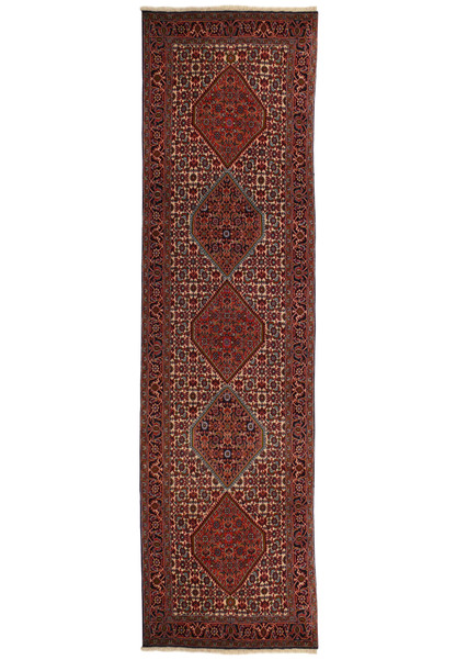 Antique Persian Bijar Runner Rug with deep reds and intricate geometric patterns displayed against a cream background, full view