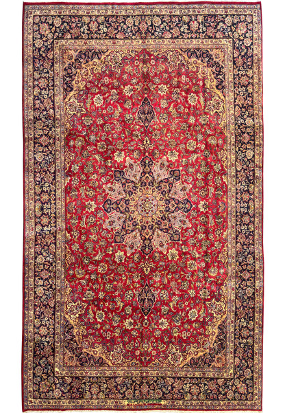 Full view of a 10 x 17 Persian Isfahan rug on display - A high-resolution image showcasing the entire Persian Isfahan rug, prominently displaying its red field and intricate floral and botanical motifs.