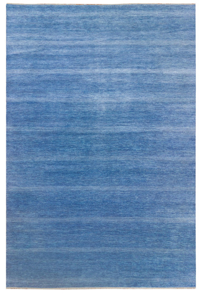 Full view of the blue 12x18 hand-knotted rug on display