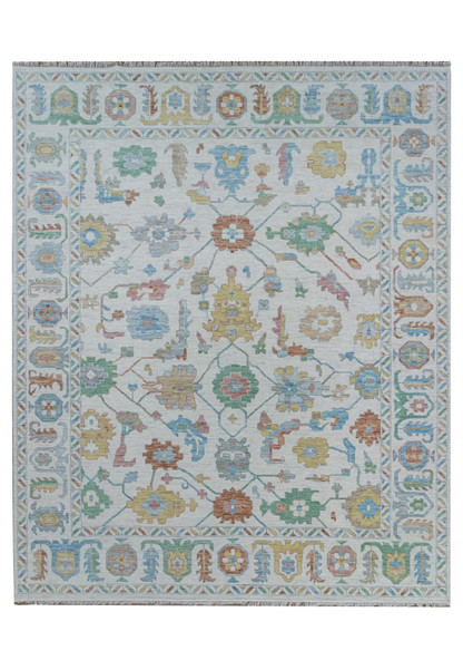 Full view of large 12'3" x 15' Oushak rug with pastel colors.