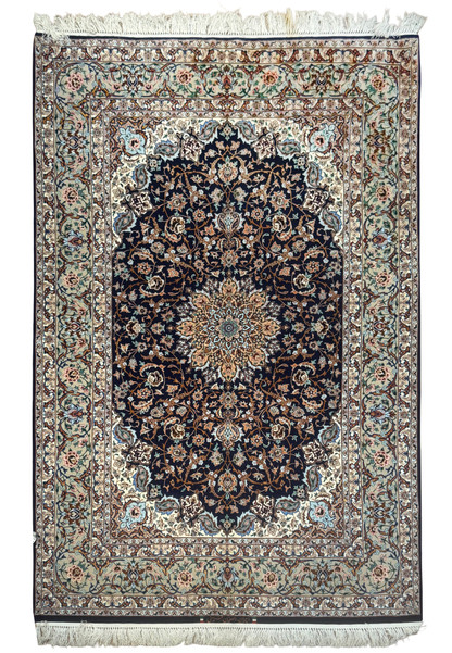 Full view of 4'11 x 7'7 signed Persian Isfahan rug with navy field and intricate floral medallion design in wool and silk