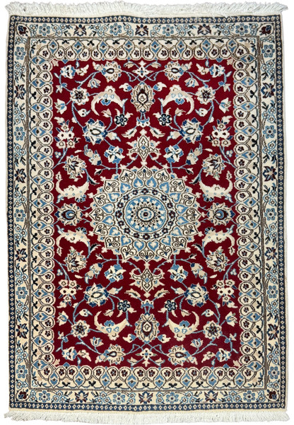 Full view of a 3x4'6 Persian Nain 9la rug with red field and ivory floral border