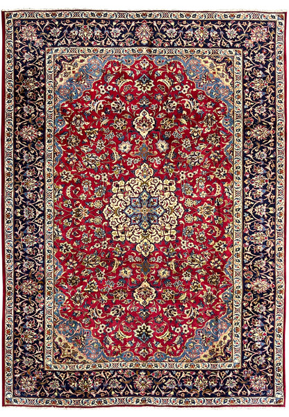 Full view of 8'5 x 11'8 Persian Isfahan rug showing red wool field, ivory medallion, and navy floral border.