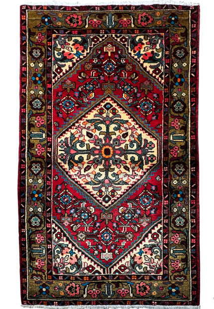 Intricately patterned 3'3 x 5'2 Persian Hamedan rug with a dominant red field and a central floral medallion."